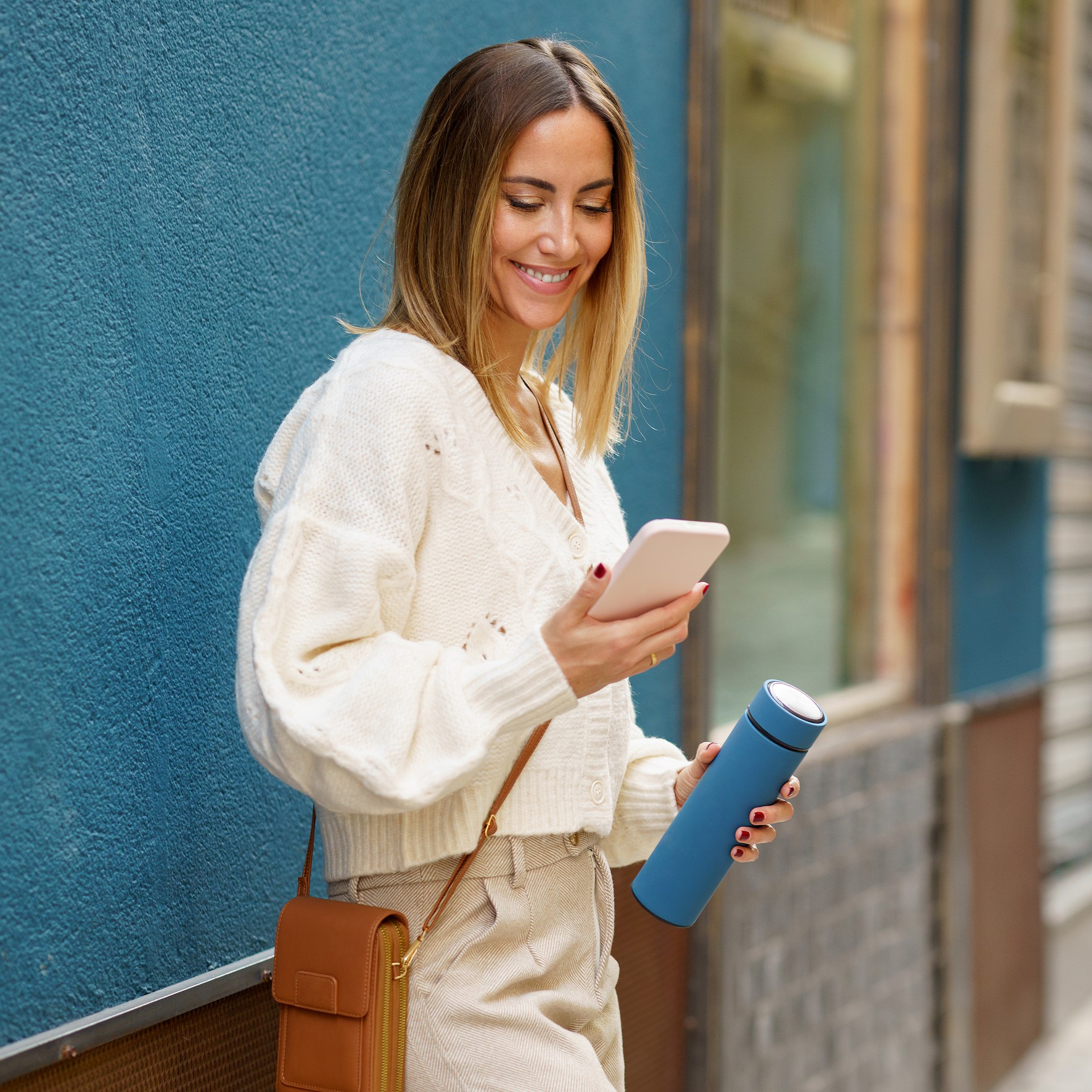 A woman searching on her phone "Why Do I Need an Ultrasound?"