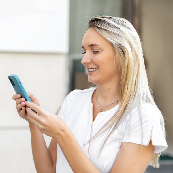 Woman searching on her phone "Does insurance cover the abortion pill?"