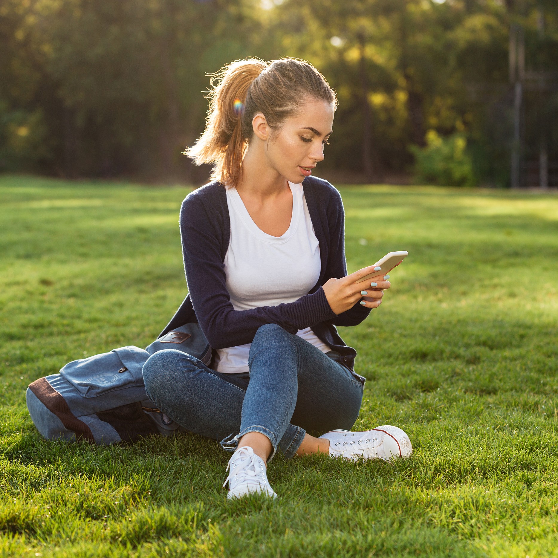 Woman searching on her phone "How Much Does the Abortion Pill Cost in Toledo, Ohio?"