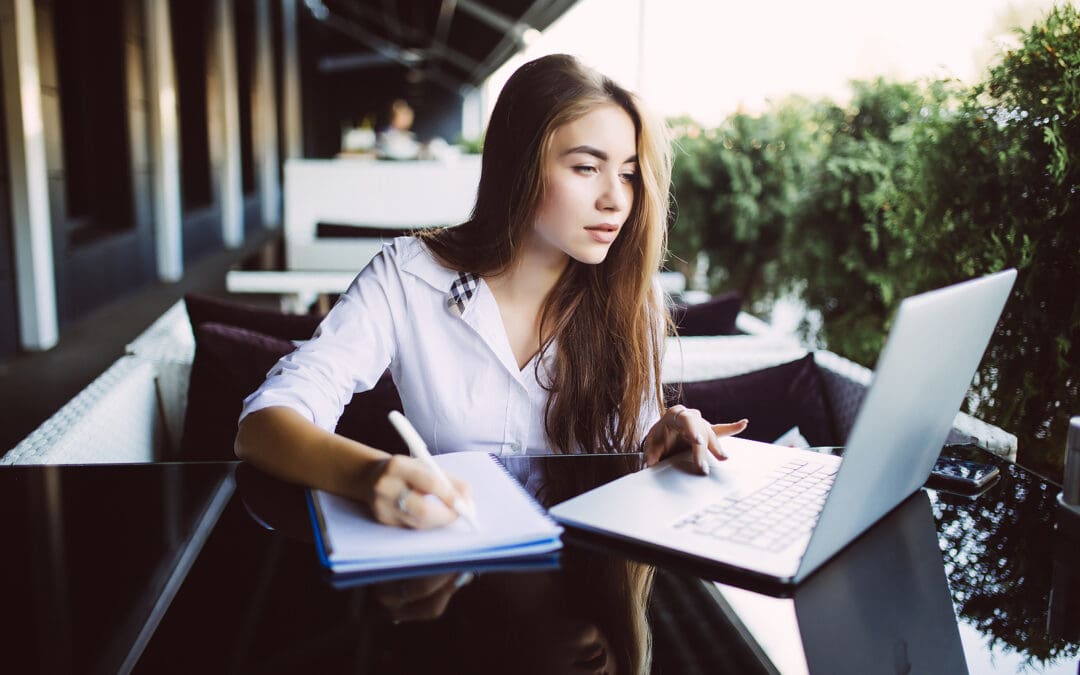 young woman looking at laptop