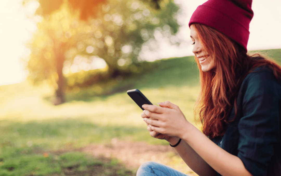 Young Woman looking down at phone